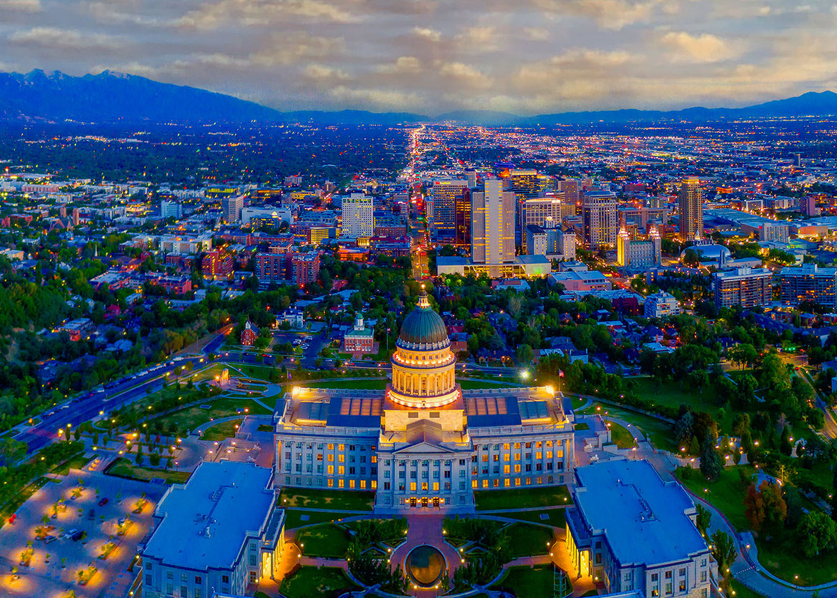 Salt Lake City skyline at dusk, the Utah State Capitol above downtown.